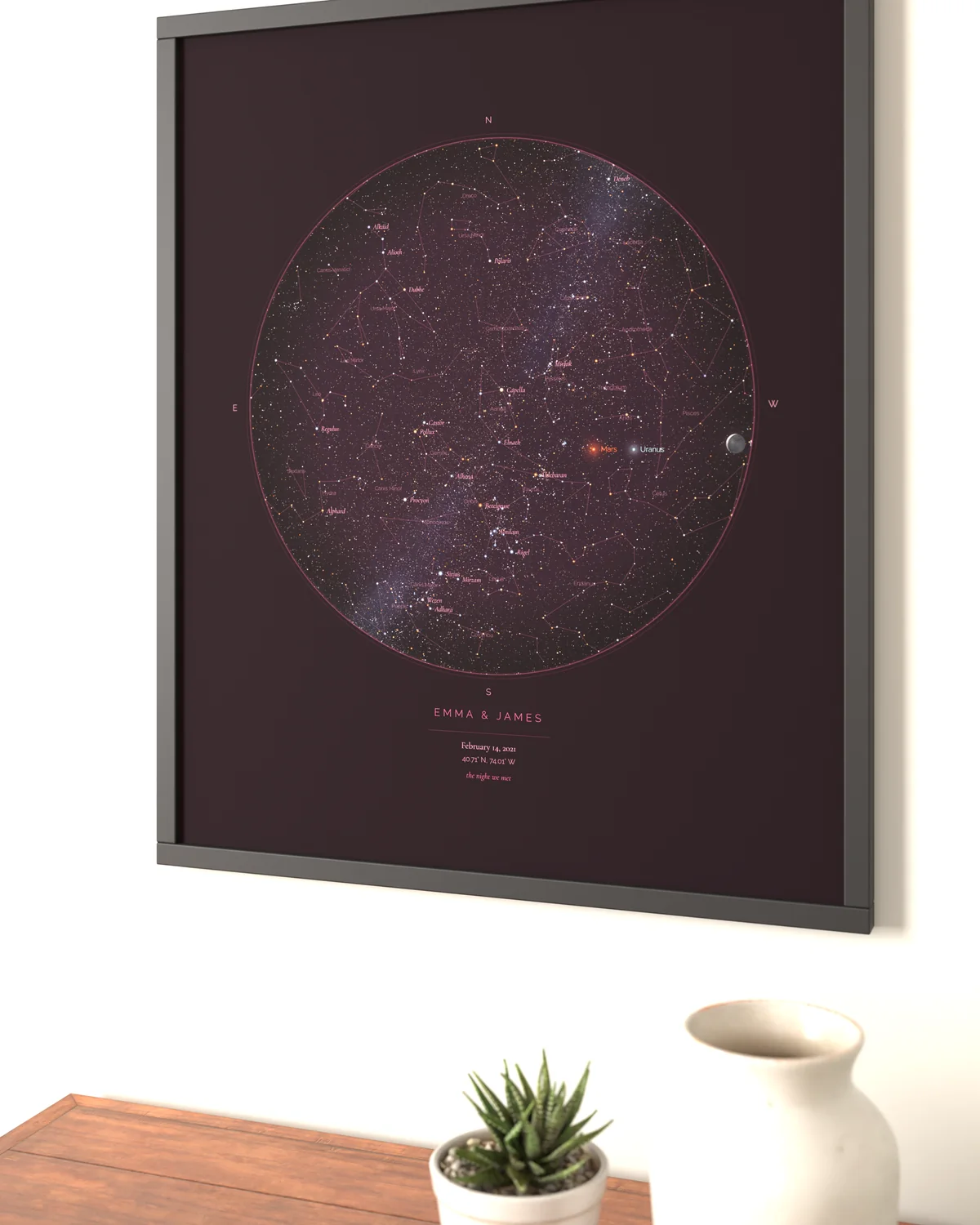 Up close: StarMap print framed in the wall above a wooden desk